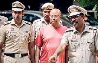 Godman accused of harassment taken to campus again; porn material seized