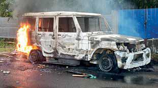 Protesters clash with police, set vehicles on fire outside prison
