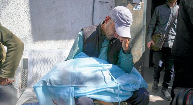 Strikes across Gaza kill at least 92 as Israel prepares to ramp up its offensive