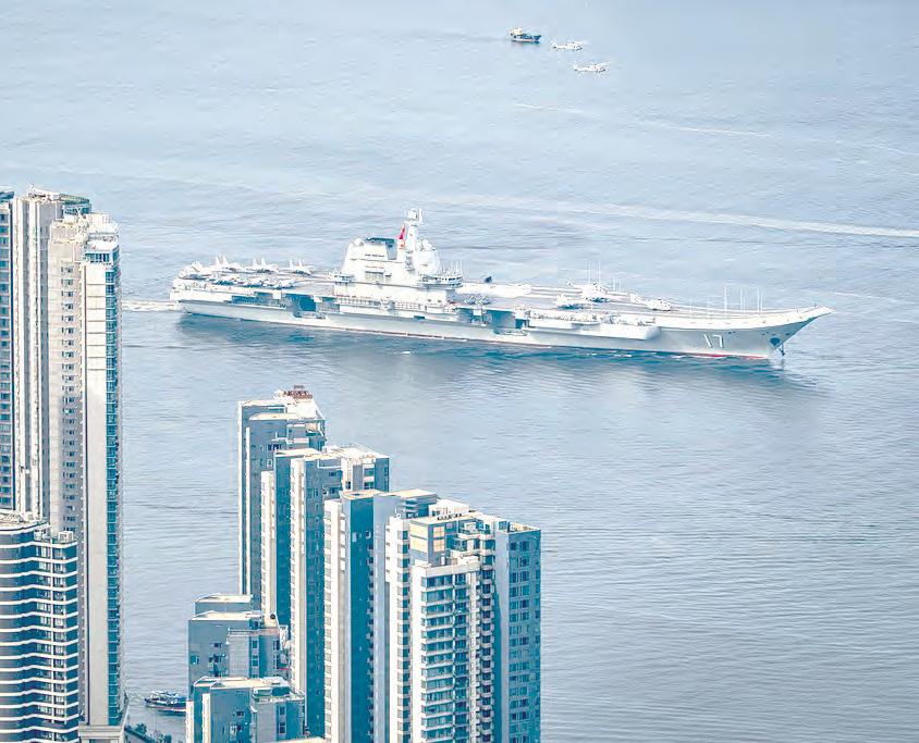 Chinese aircraft carrier sails into Hong Kong to boost patriotism