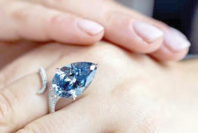 Blue diamond sold at $26.6M