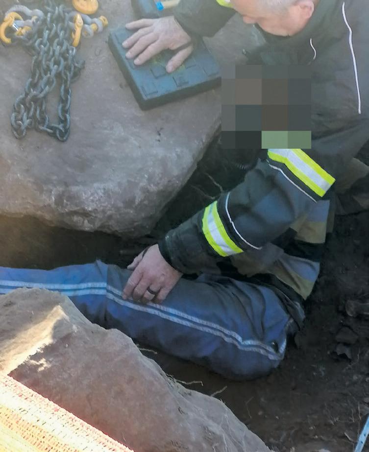 Man rescued after being trapped by rock