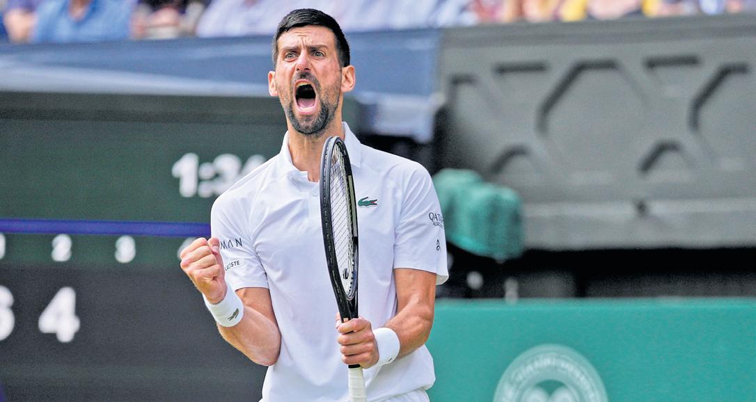 Djokovic battles back to keep record chase alive