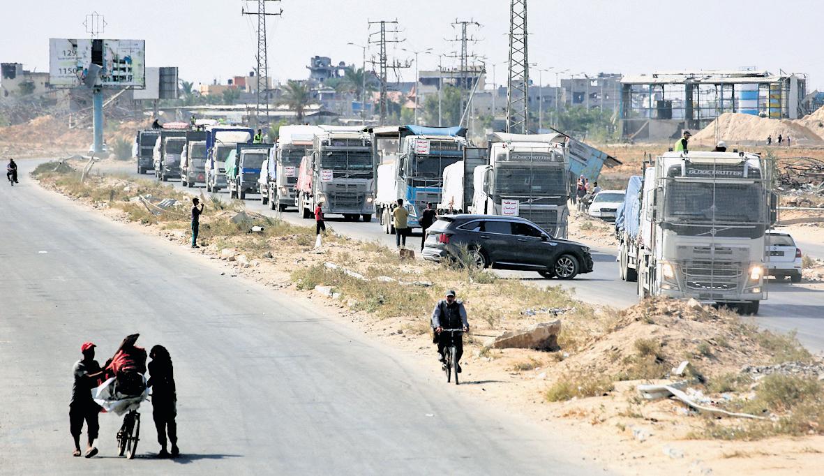 Amid attack threat, Hamas says working to return all bodies