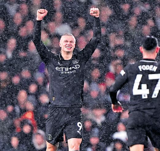 Record-breaking Haaland helps City win in thriller