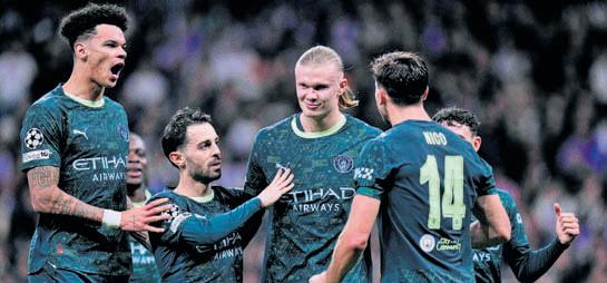 Manchester City edge Real, Arsenal maintain perfect record