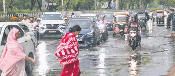 Capital cool: Heavy rain, thunderstorm and gusty winds bring down mercury