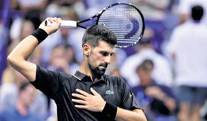 Djokovic shakes off back problem to reach Round 4