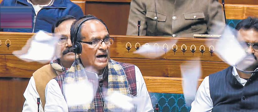 Torn papers fly as Parliament approves the G-Ram-G bill replacing the Mahatma