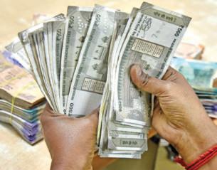 Rupee slides to all-time closing low of 92.35