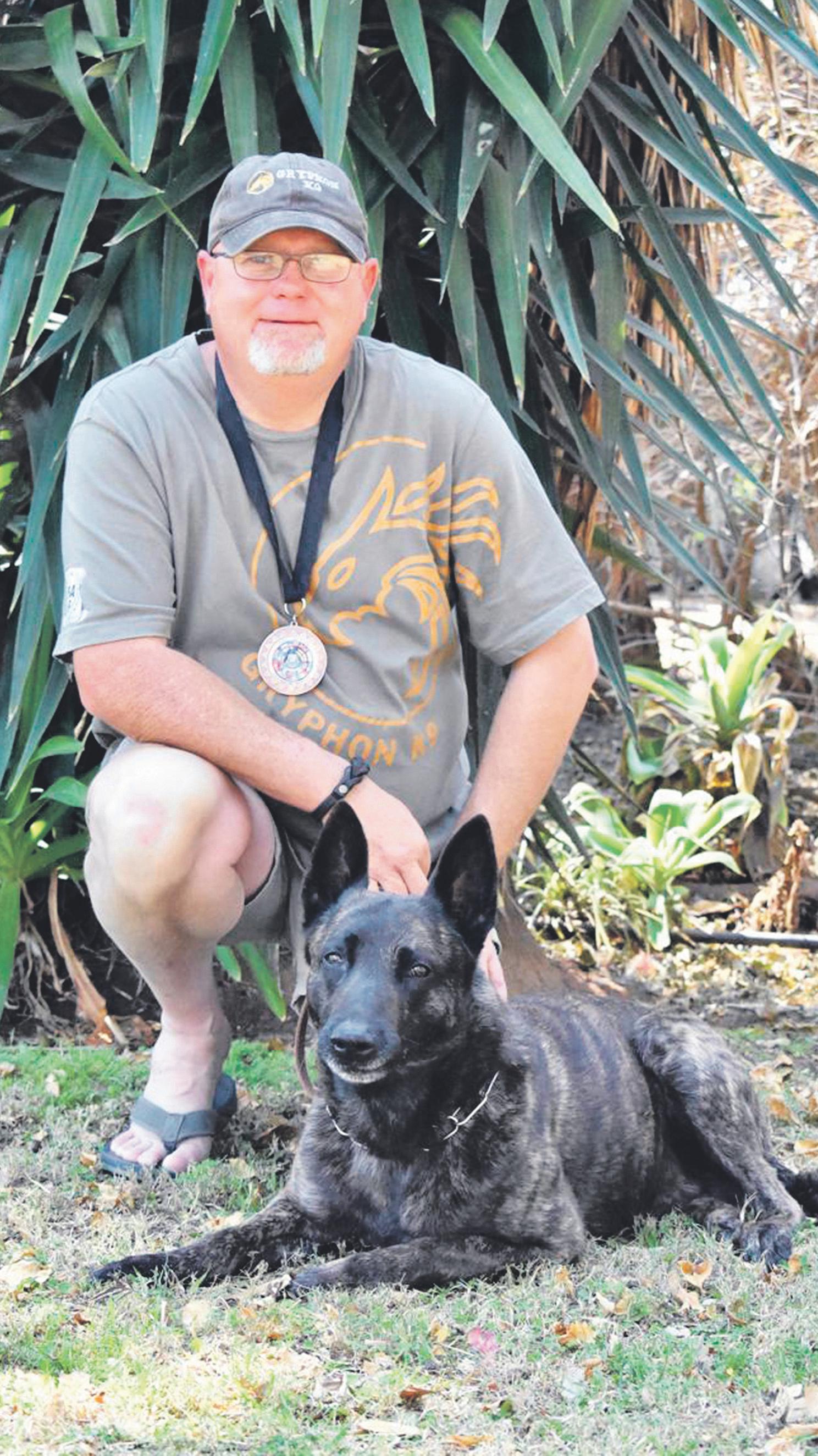 Local trainer, Klaus the dog win PSA competition
