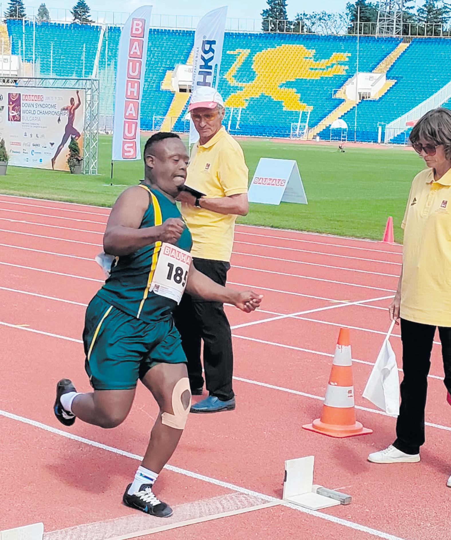Down Syndrome athlete flies SA flag