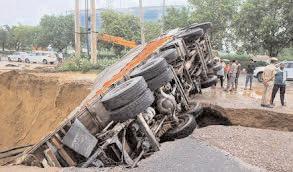 Overnight rain brings Gurugram to its knees, beer-loaded truck falls into caved-in road