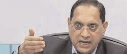 SEBI chief warns investors on fraudsters offering them guaranteed return schemes