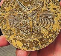 Olympic firm to replace its rusty medals