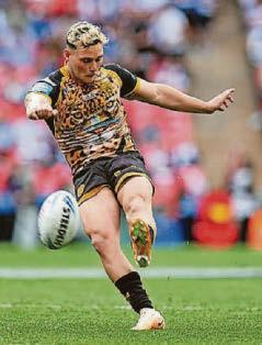 LAM GETS A KICK OUT OF WEMBLEIGH