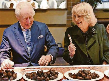 IT'S A DATE FOR KING AND QUEEN AS THEY HELP CHARITY VENTURE