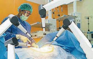 Robots approved to do NHS ops on tumours and hips