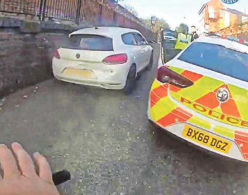 Shock moment banned driver tries to mow down police