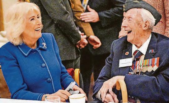 George, 11, chats to heroes at tea party