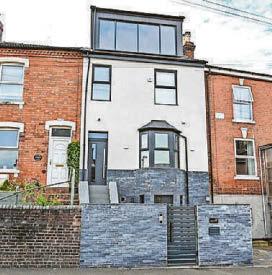 Row over extension that's like a 'football stadium executive box'