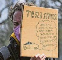 Anti-Musk protestors torch Teslas
