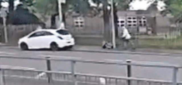 MANIAC MOWS DOWN WOMAN