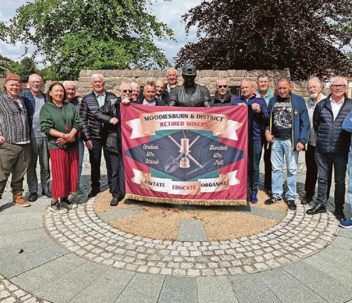 Retired miners display new banner for branch