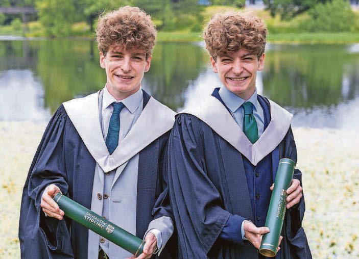 Seeing double as two sets of twins graduate together