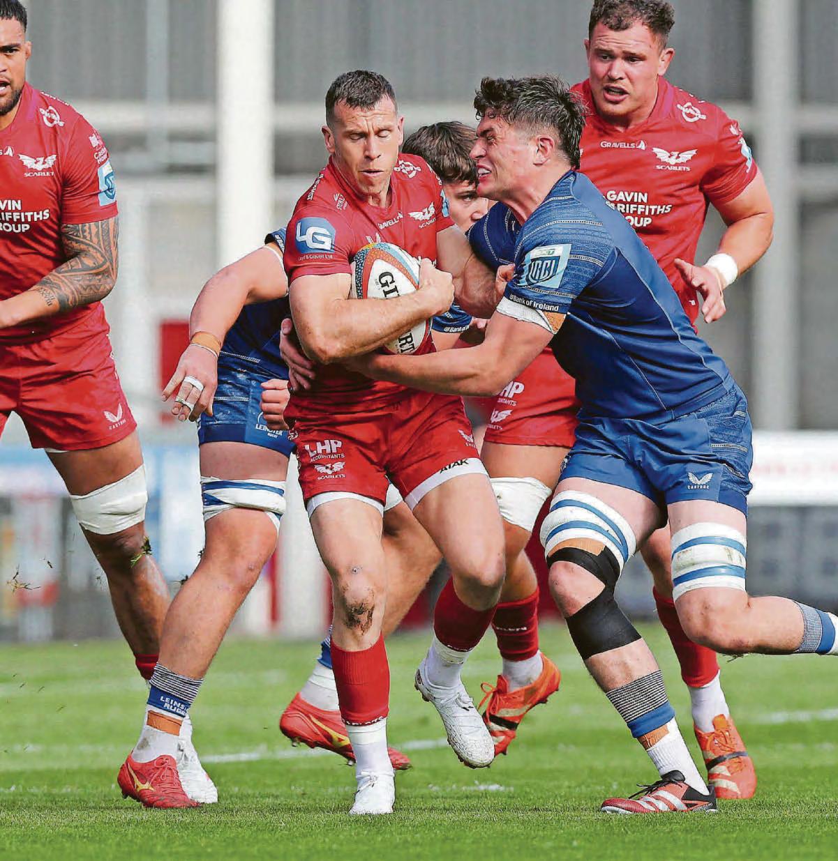 SCARLETS HIT FORM TO SHOCK LEADERS