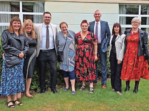 Asda store staff clock up 275 years of service and celebrate discount card for life