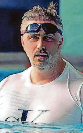 Gym staff make a splash with swim challenge to support veterans' charity