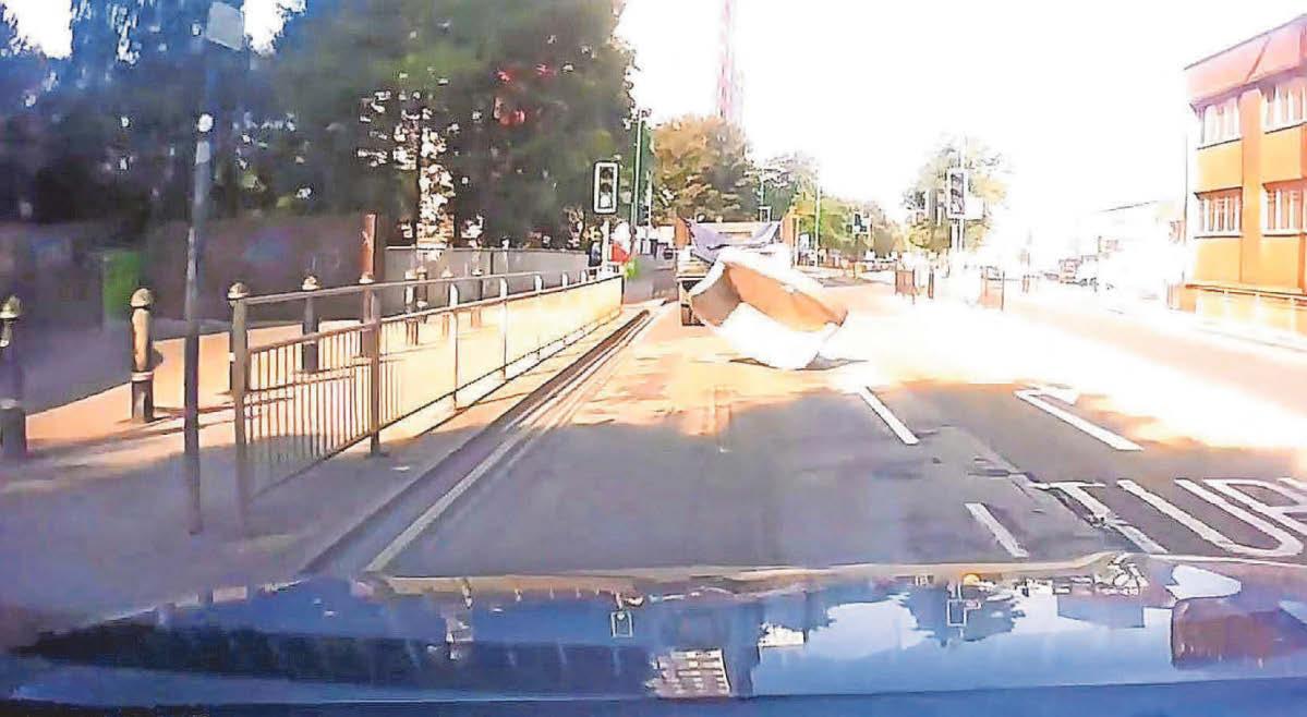 'Really heavy' sofa cartwheels into path of a car on city road