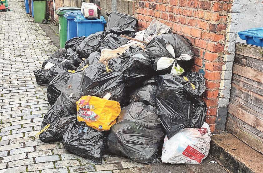 Woman faces £1,100 bill over dumped big bags in back alley