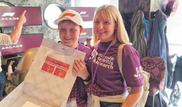 Teenager gets signed Formula 1 cap for raising awareness of childhood arthritis