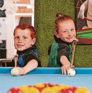 Pocket-sized pool player taking on teen opponents