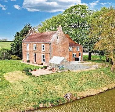 Farmhouse surrounded by its own moat on the market for £400,000