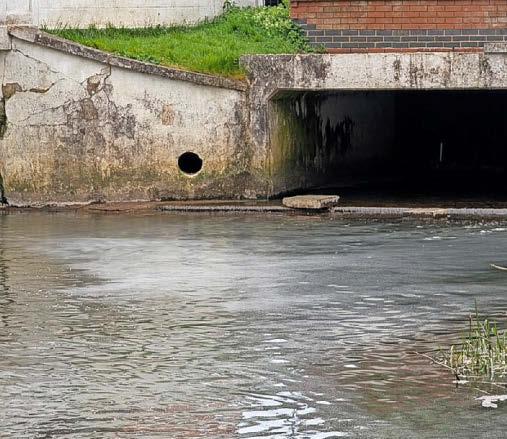 Suspected pollution turns river water dull and grey