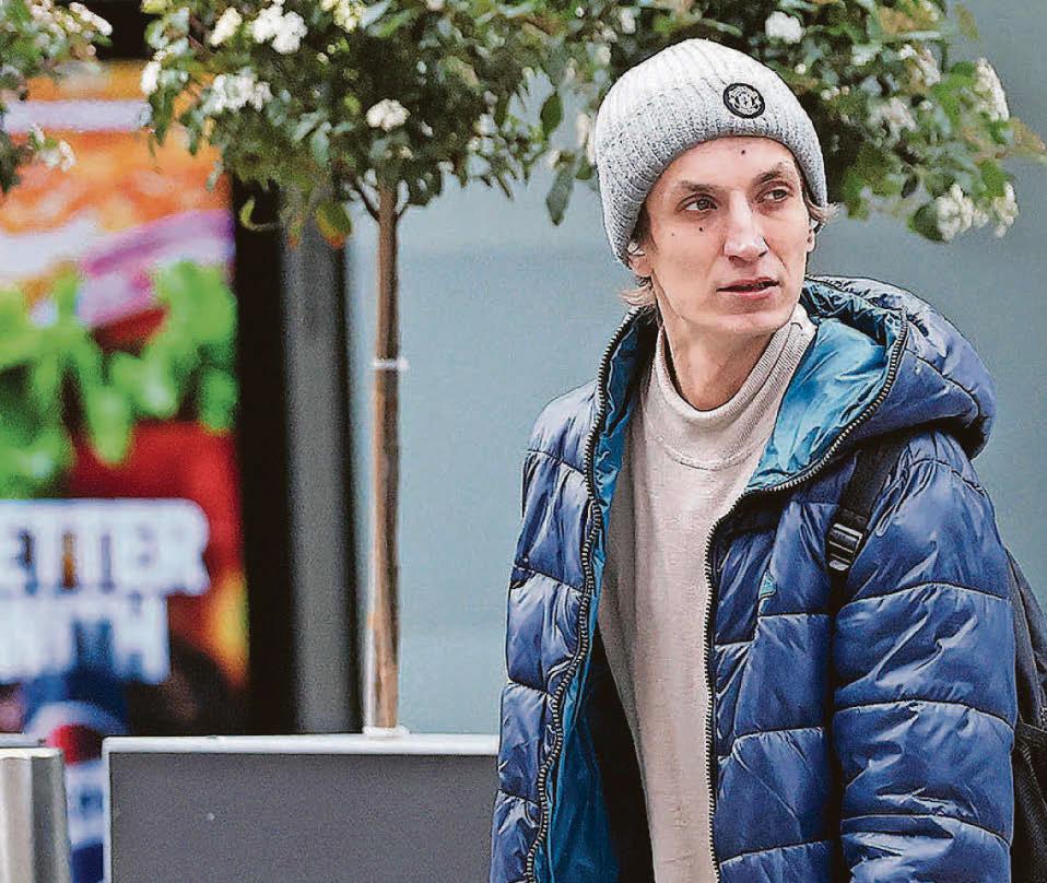 Riot yob spat in Muslim woman's face