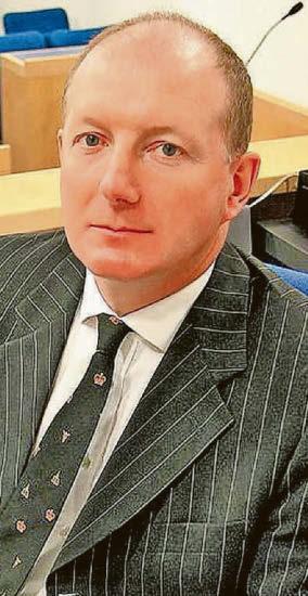 City's senior coroner retires after suspension