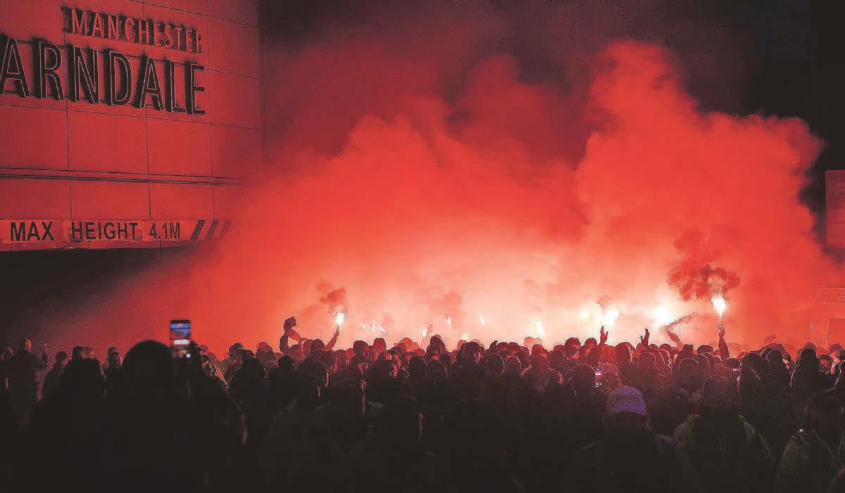Rival fans play flare