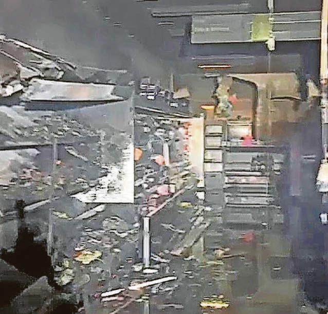 Blaze-hit store back in business