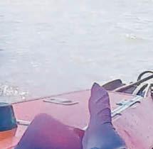 Lifeboats to rescue of man clinging to pier