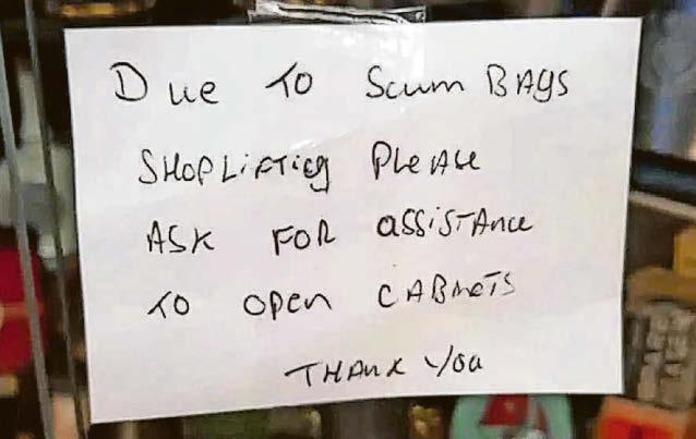 Police: We didn't tell shopkeeper to take down 'scumbags' sign