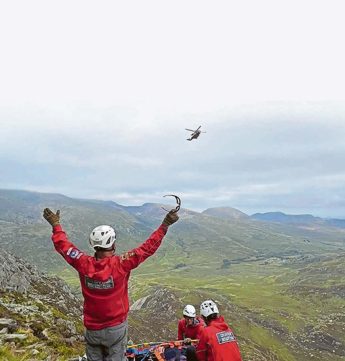 Climbers help walker with injury then they have to be rescued too