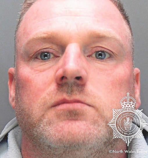 Man threatened to put pickaxe through his partner's head