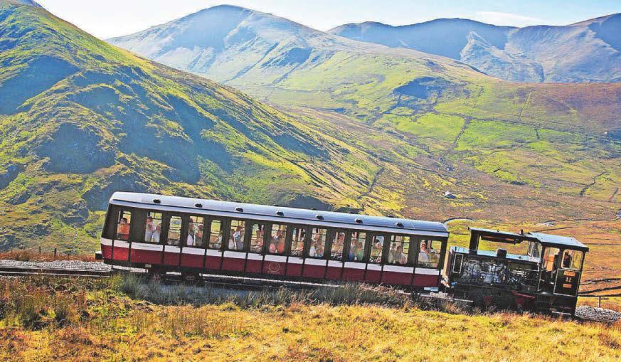 Cyclist spotted riding mountain rail tracks