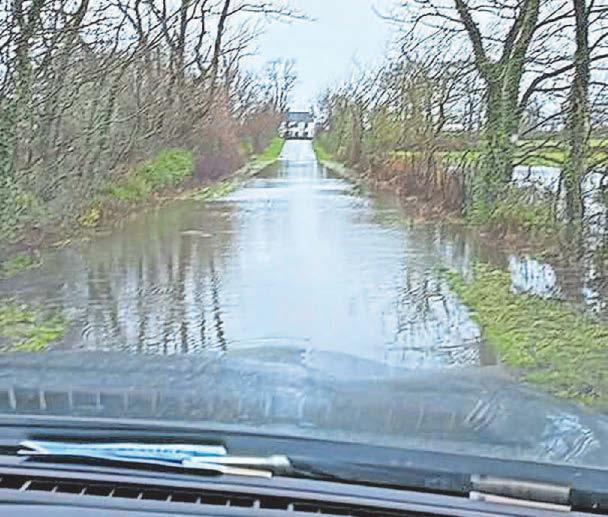 Travel disruption as deluge floods roads