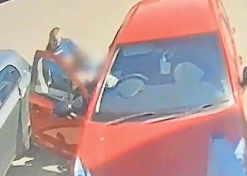 MOMENT ROBBER FORCES WOMAN FROM CAR