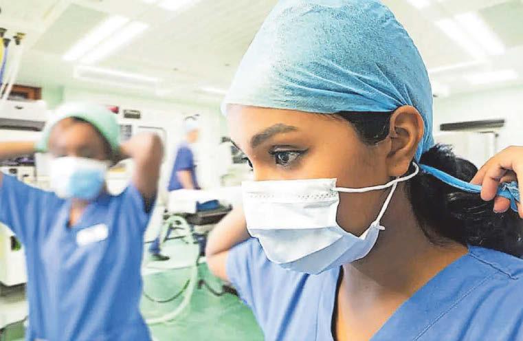 Face masks urged for all in key parts of hospitals to curb danger flu surge
